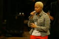 Primary view of [Chrisette Michele singing on stage]