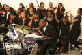 Photograph: [Drummer and choir performing]