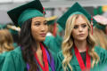 Photograph: [Two Mayborn graduates waiting for commencement to begin]