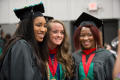 Thumbnail image of item number 1 in: '[Three graduate students at commencement ceremony]'.
