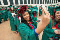 Photograph: [Undergraduate Student Taking a Selfie at Commencement Ceremony]