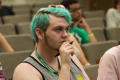 Photograph: [Student with blue hair listening to seminar]