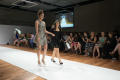 Photograph: [Two fashion design students walking on runway, 2]