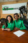 Photograph: [Andrea Czobor and Trerell Hearn at broadcast desk]