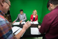Photograph: [NT Daily TV anchors going over scripts]