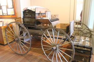 Primary view of object titled '[Buggy on display at Oregon Trail center]'.