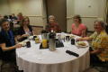 Primary view of [Attendees gathered at table for breakfast]