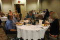 Photograph: [Attendees during breakfast]