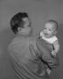 Photograph: [Bill Guy Holding a Baby]
