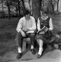 Photograph: [Unknown man and woman viewing a book]