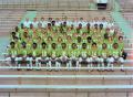 Photograph: [Football staff with the team, 4]