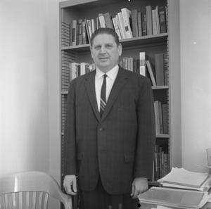Primary view of object titled '[Photograph of Dr. Friedsam in his office]'.
