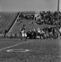 Photograph: [NTSU football players tackling WSU players, 2]