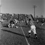 Photograph: [NTSU football players tackling WSU players, 8]
