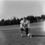 Photograph: [Football player number 68 in a field, 2]