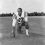 Photograph: [Football player number 27 posing in a football field, 2]