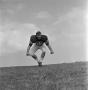 Photograph: [North Texas State football player number 56 in a field, 2]