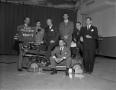 Photograph: [Group of men at the WBAP-TV soundstage]