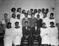 Photograph: [African American Choir with a reporter]