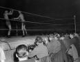 Photograph: [Row of reporters at a boxing match]