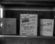 Photograph: [Advertisements in a window]