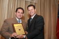 Primary view of [Fred K. Hartman presenting award to Trey Martinez Fisher]