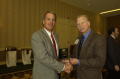 Photograph: [Donnie Baggett handing out plaque award to Bill Cornwell]
