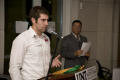 Photograph: [Matt Wolodzko speaking at podium]