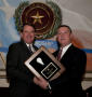 Photograph: [Man receiving award at the TDNA 2011 conference]