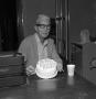 Photograph: [Man with birthday cake]