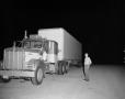 Photograph: [Bill Mack next to large truck]