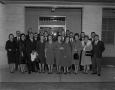 Photograph: [Large group of men and women wearing coats]