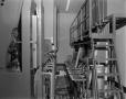Photograph: [Behind view of film reel machinery]