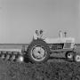 Photograph: [Two Men on a Ford tractor]