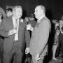 Photograph: [Two men socializing at a party]