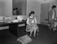 Photograph: [Patsy Alexander opening gifts]