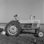 Photograph: [Two Men conversing on a tractor]
