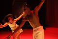 Photograph: [Photograph of a woman and man dancing together on a stage]