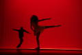 Photograph: [Photograph of the silhouette of a man and woman dancing on stage]