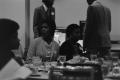 Photograph: [Juanita Simmons and Lillie Turner seated at a dining table]