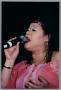Primary view of [Close-up of Angela Bofill singing into microphone]
