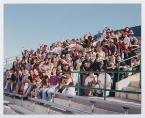 Primary view of object titled '[Photograph of interactive TAMS students on UNT stadium bleachers]'.