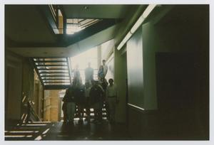 Primary view of object titled '[Photograph of TAMS group in a building]'.