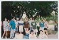 Photograph: [Photograph of TAMS group on campus sidewalk]