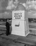 Photograph: [Harold Taft standing near the WBAP-TV weather radar]
