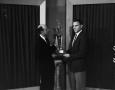 Photograph: [Bud Sherman presenting trophy]