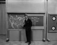 Photograph: [Larry Morrell and weather board]
