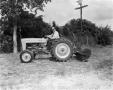 Thumbnail image of item number 1 in: '[Photograph of Doc Rhuman on a Ford tractor]'.
