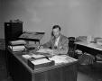 Photograph: [Thaine Engle at his desk]