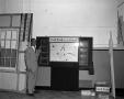 Photograph: [Photo of Dale Hart conducting weather review]